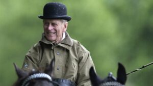 The Prince Philip, Duke of Edinburgh carriage driving in Windsor Great Park wearing a Bowler Hat.