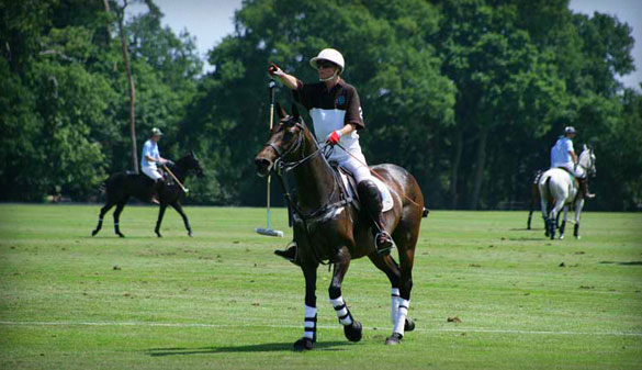 A polo player rides across the field at Smith's Lawn.