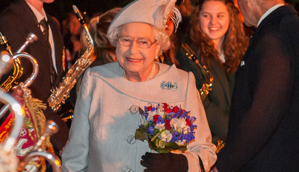 On the 70th anniversary of VE Day, Queen Elizabeth II lights the first of two hundred beacons lit across the UK.