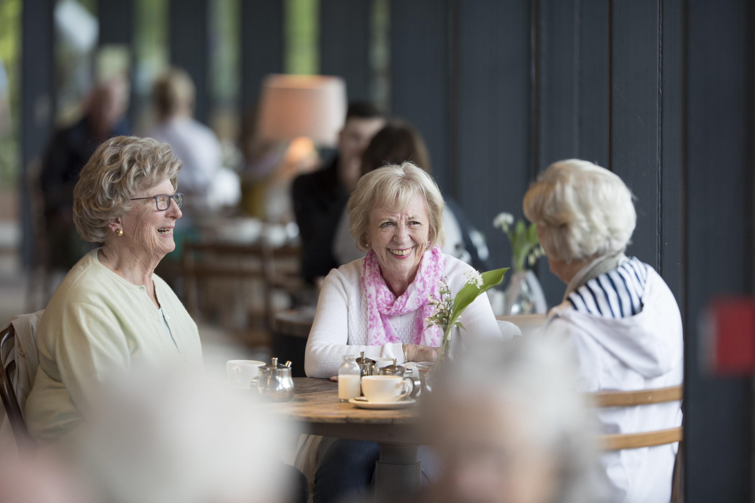 Three people sat in the Gallery Café.