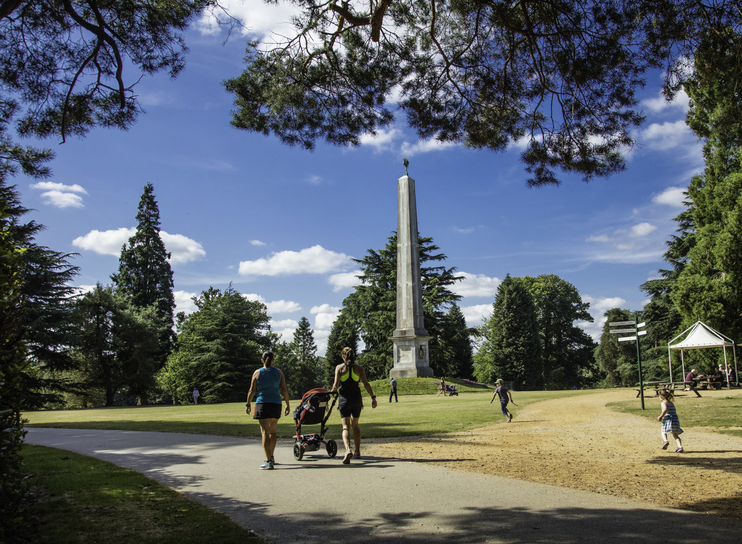 A family walking on a path at Obelisk Lawn.