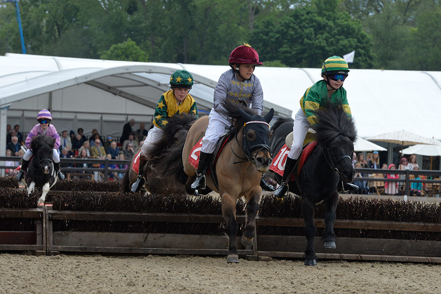 Young People riding horses.