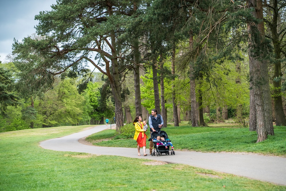 A family walks through the Park.