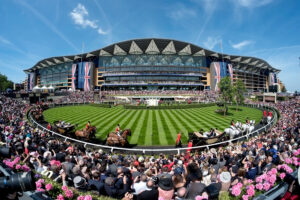 ASCOT, ENGLAND - JUNE 17: A general view of the Grandstand and Parade Ring during the Royal Procession on day one of Royal Ascot at Ascot Racecourse on June 17, 2014 in Ascot, England.
