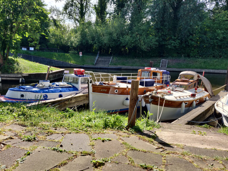 Three boats docked at Tom Jones Boatyard.