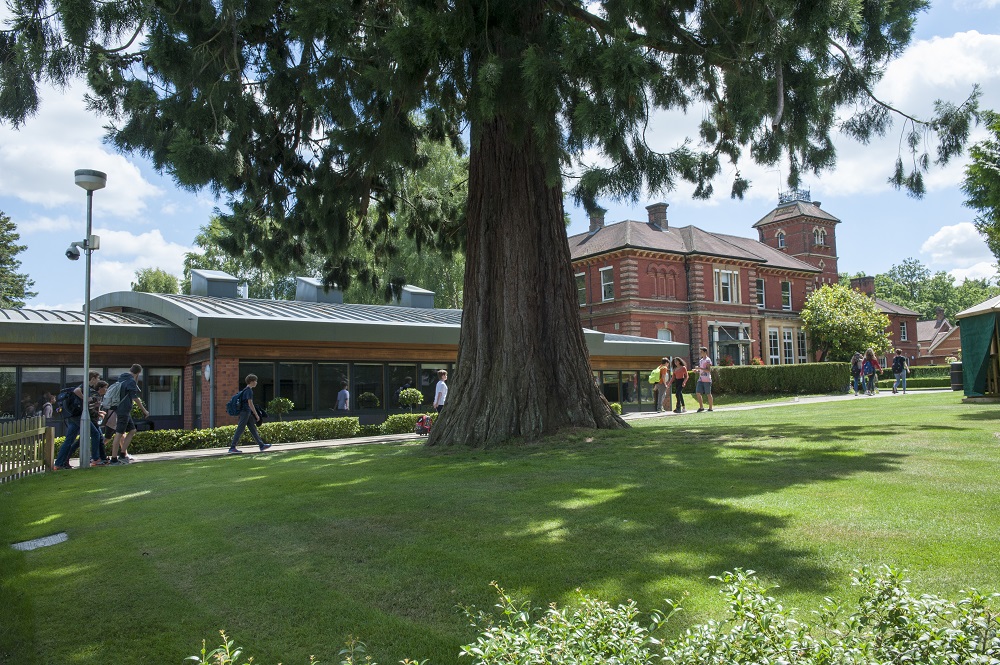 View of American Community School grounds with students.