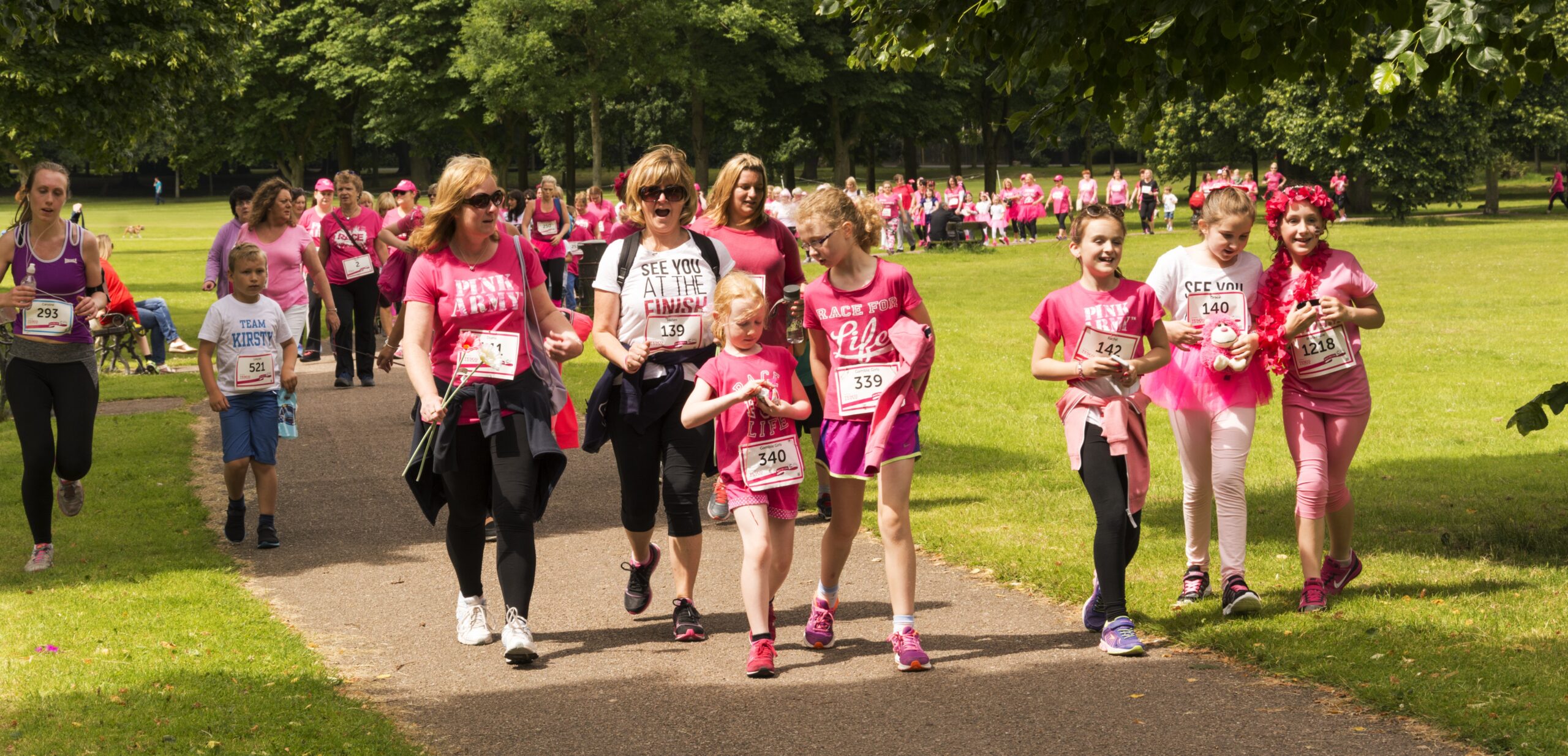 Group of people walking in a charity event.