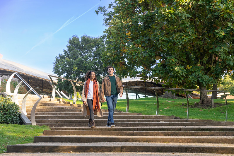 Couple walking down the steps into The Savill Garden.