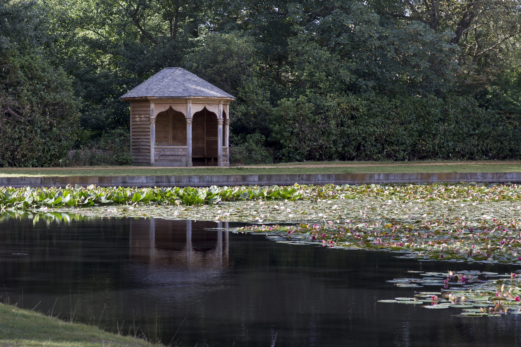 View of the Arbour at Cow Pond with Lilies on the water. 