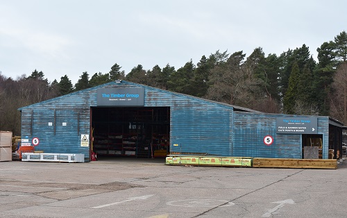 Warehouse and Yard with stacked wood, The Timber Group.