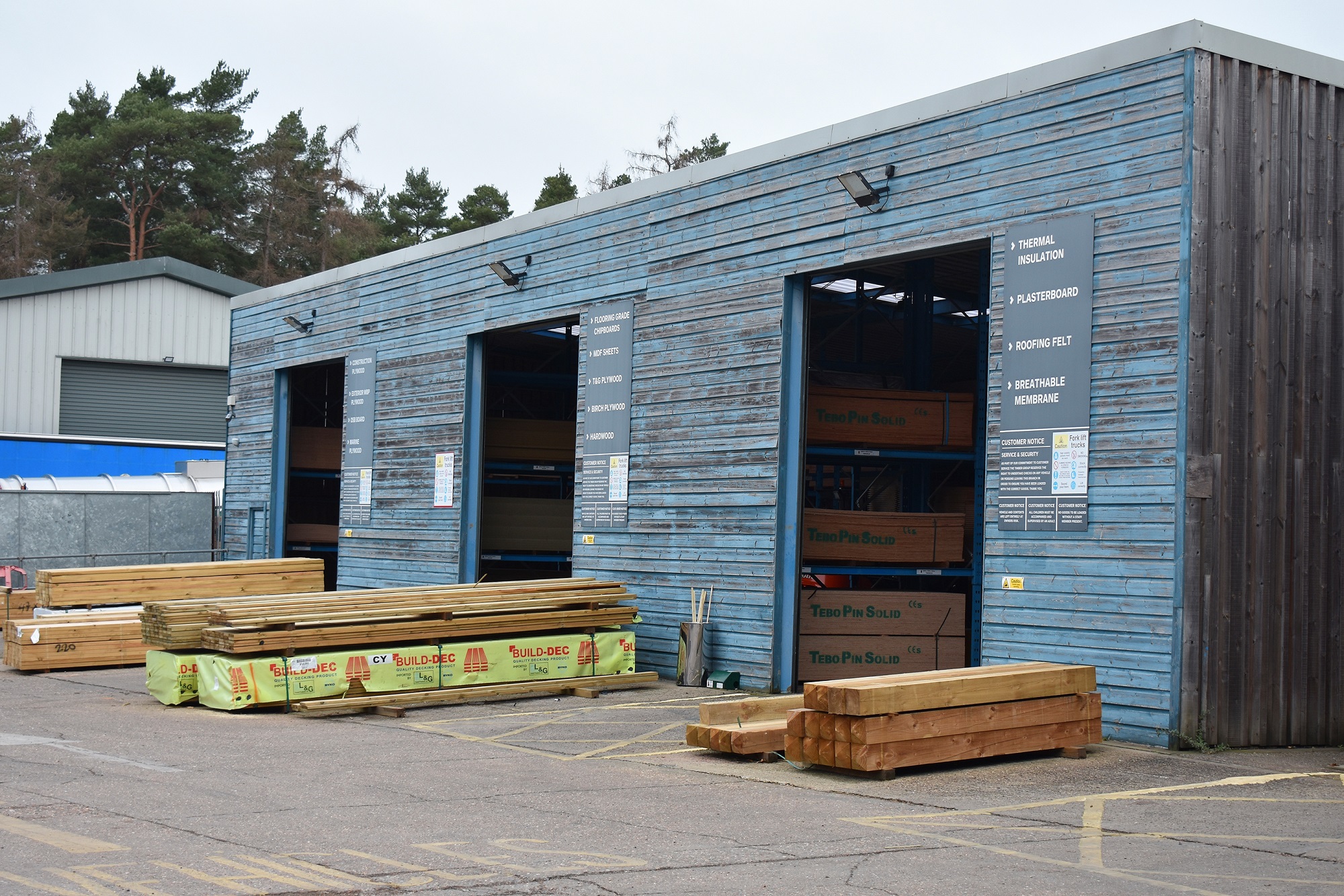 Warehouse with blocks of stacked wood, The Timber Group.