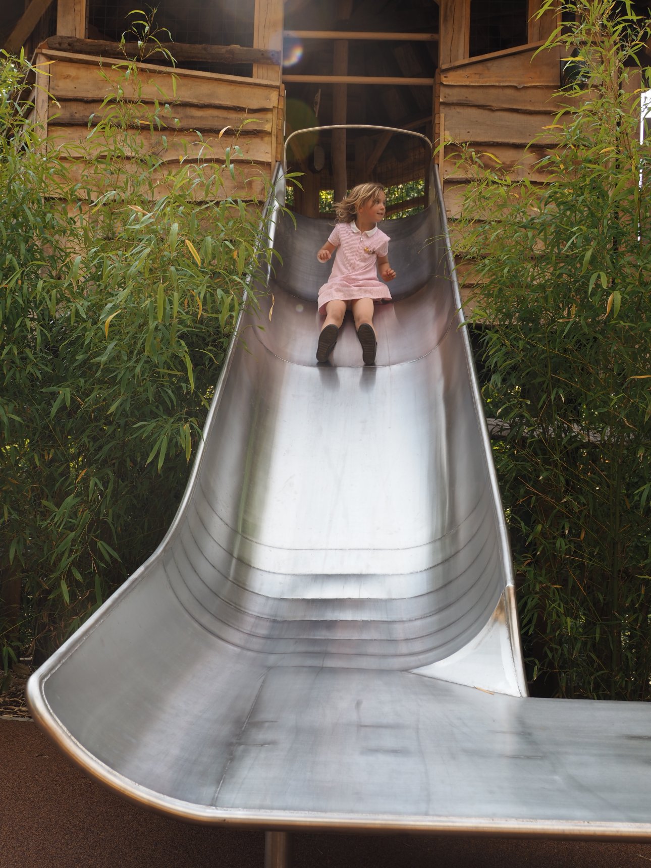 Young child on a slide.