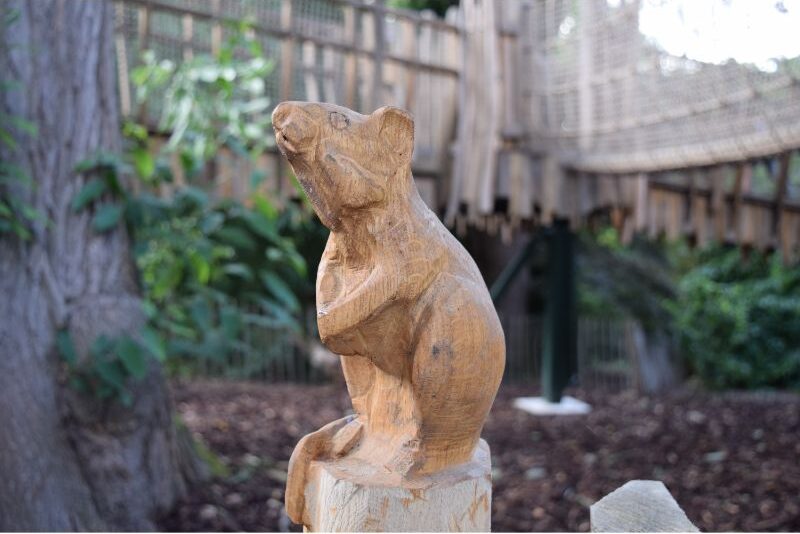 Wood carving of a mouse.