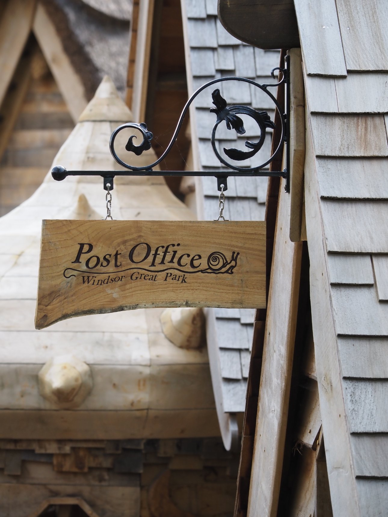 Wooden sign for the Windsor Great Park , Adventure Play, Post Office.