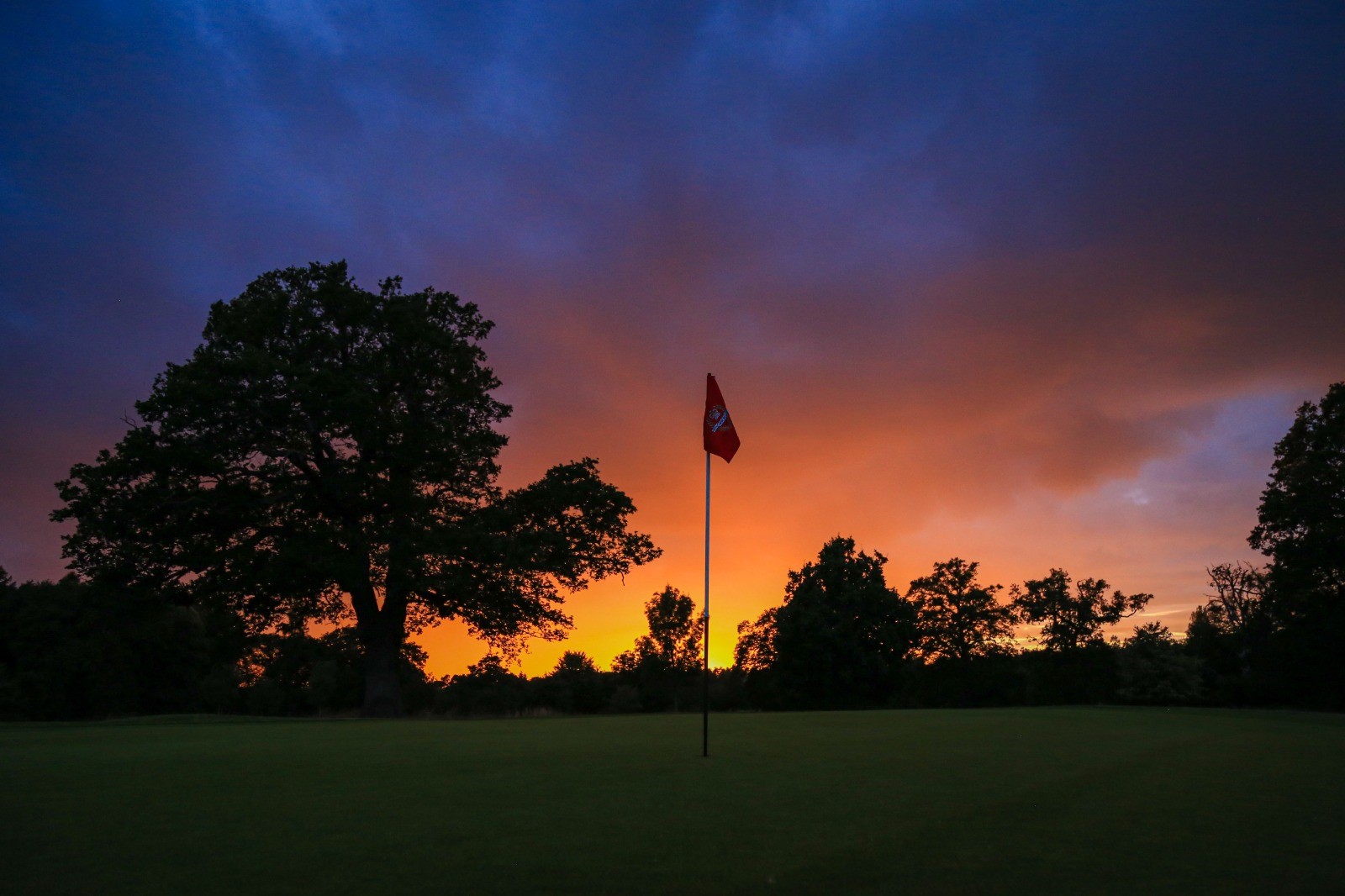 Sun rising over a tee at Royal Ascot Golf Club.