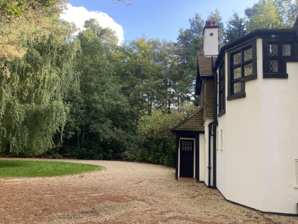 View of the front door area and turning circle driveway of Pinewood Lodge, Swinley Road, Ascot, SL5 8BA