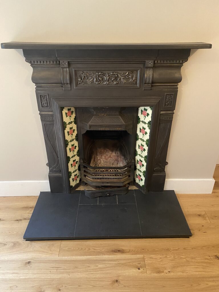 An open fire with mantlepiece in Pinewood Lodge, Swinley Road, Ascot, SL5 8BA