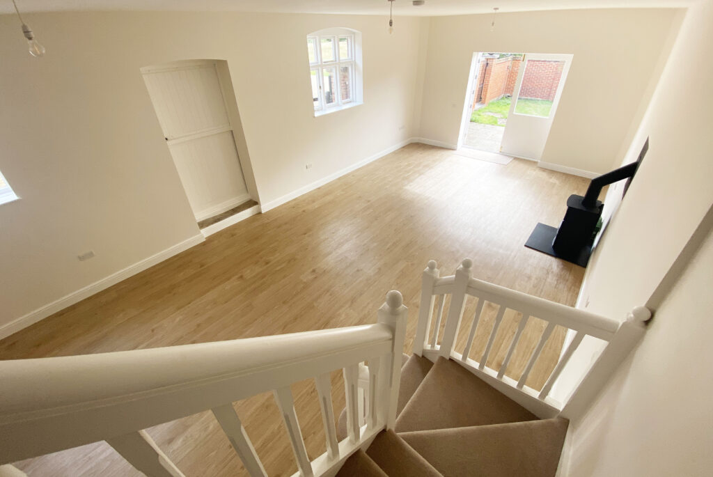 View of the reception room from the stairs in 6 Home Farm, Bagshot Park