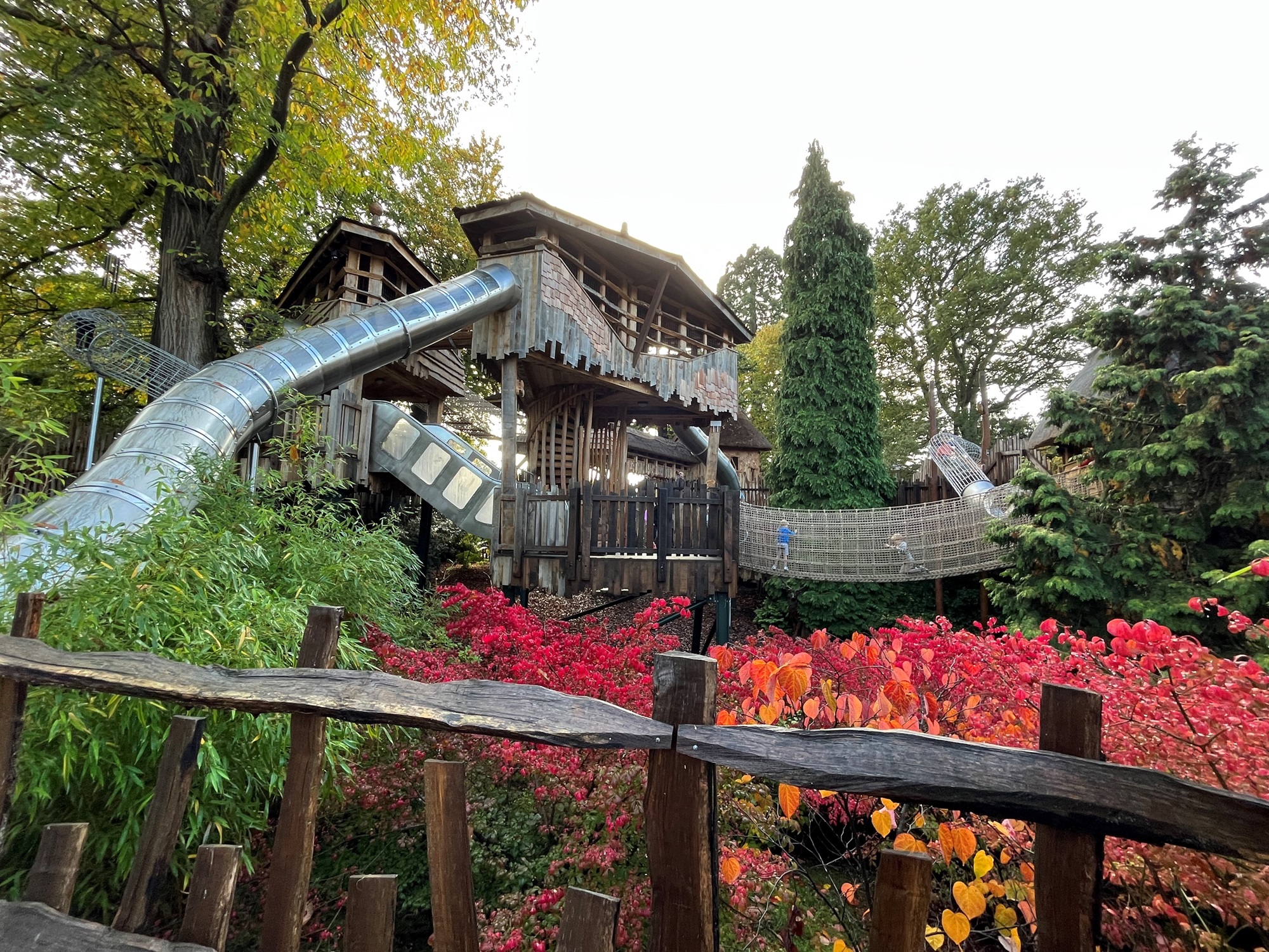 View of Adventure Play slides and towers in autumn.