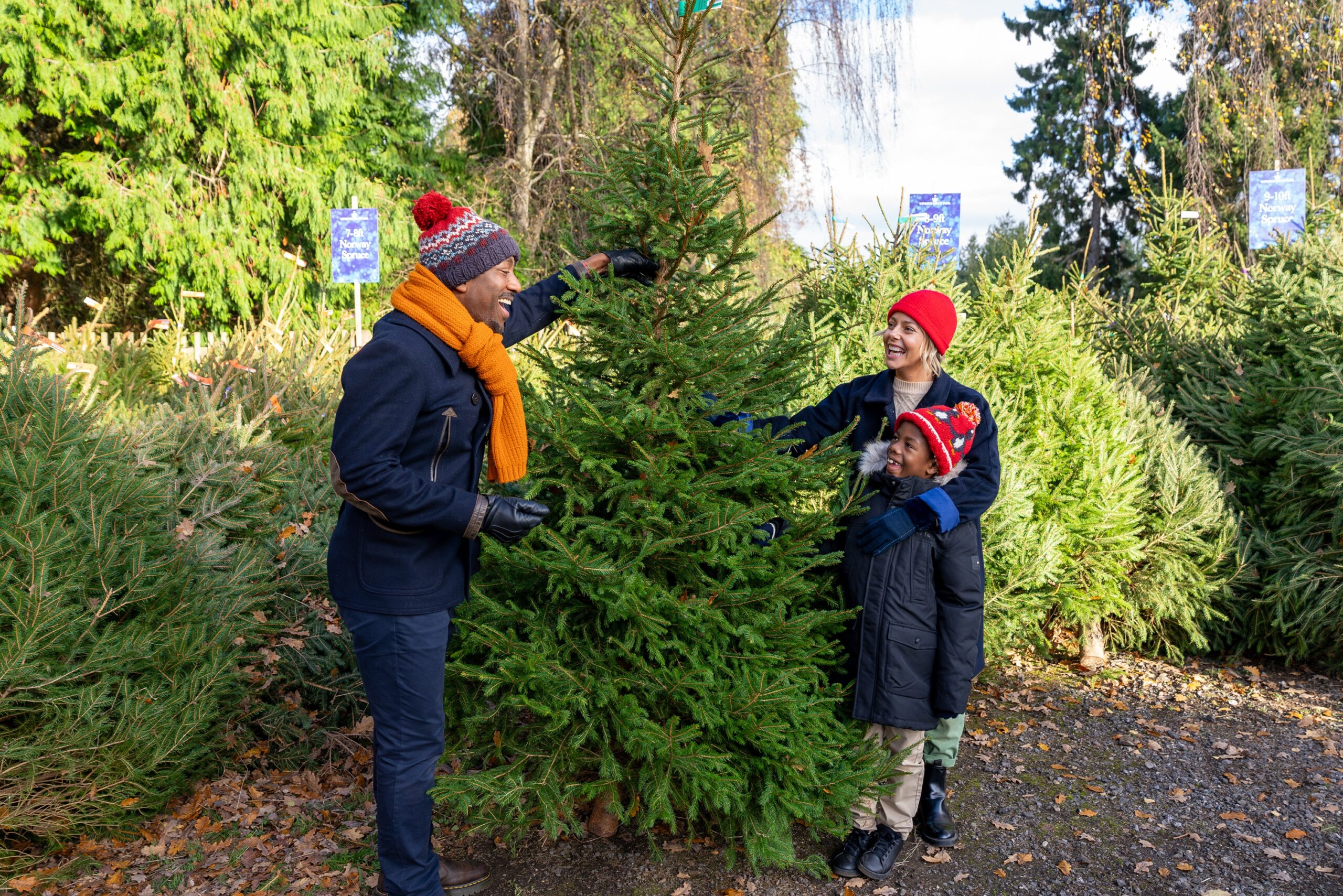 Family from multi ethnic background at the Christmas Tree Shop.
