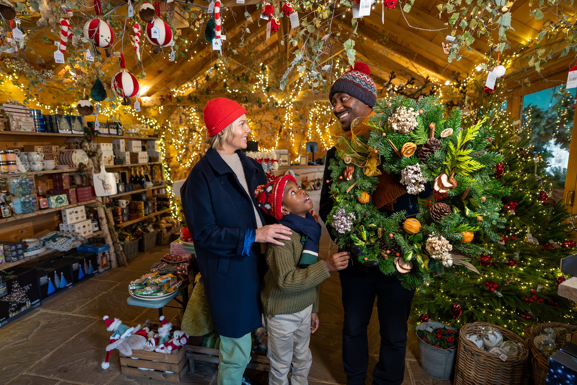 Family from multi ethnic background in Christmas Tree Shop.