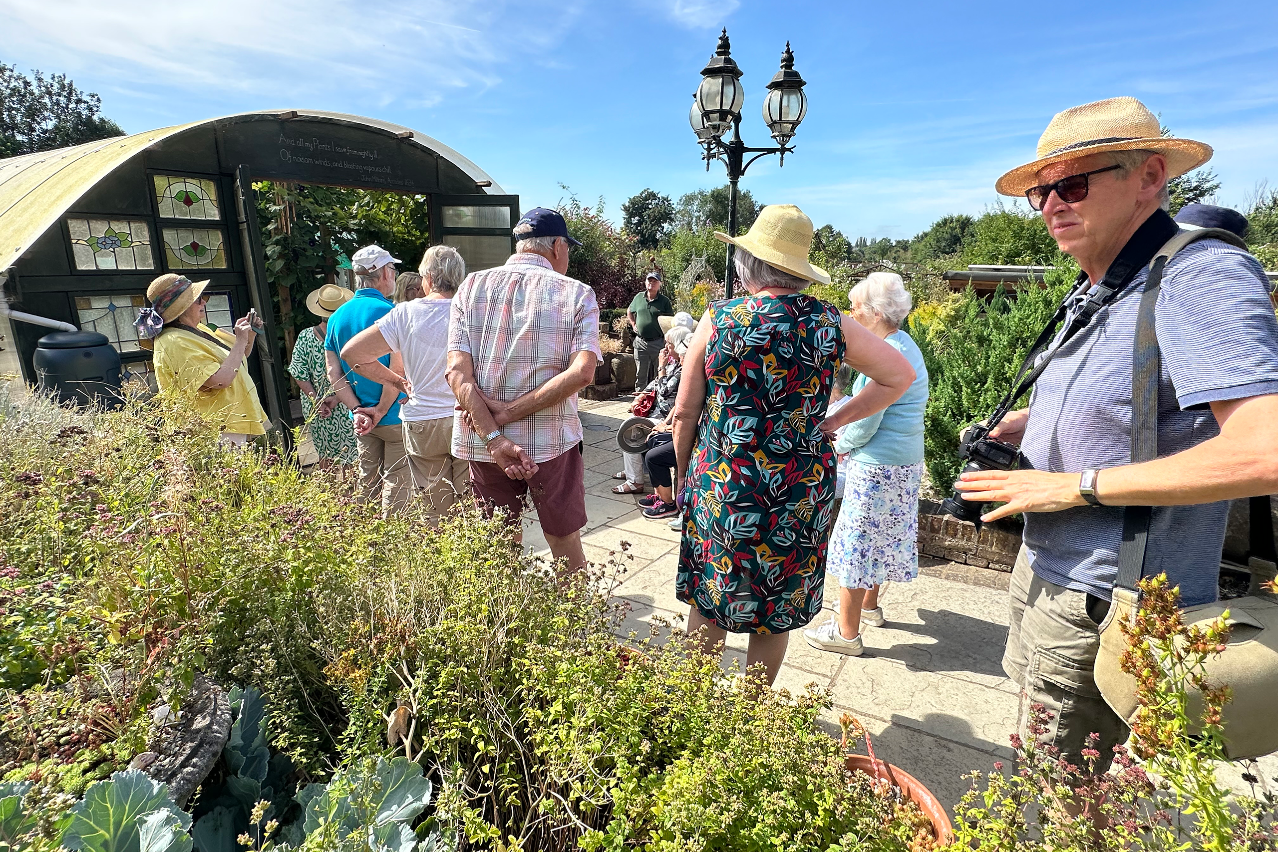 Friends standing beside raised beds at Church Gardens.