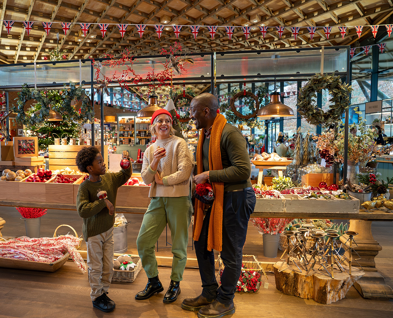 Family from multiple ethnic background in The Savill Garden Gift Shop. 