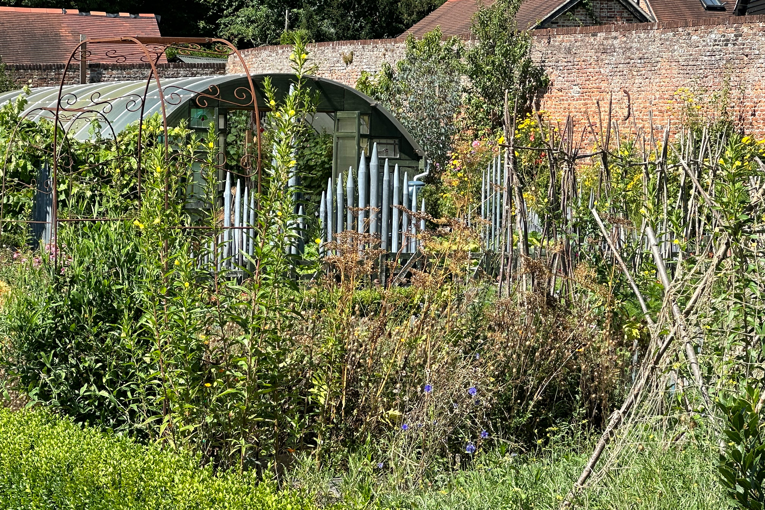 A garden feature made from reclaimed organ pipes in a pumpkin patch 