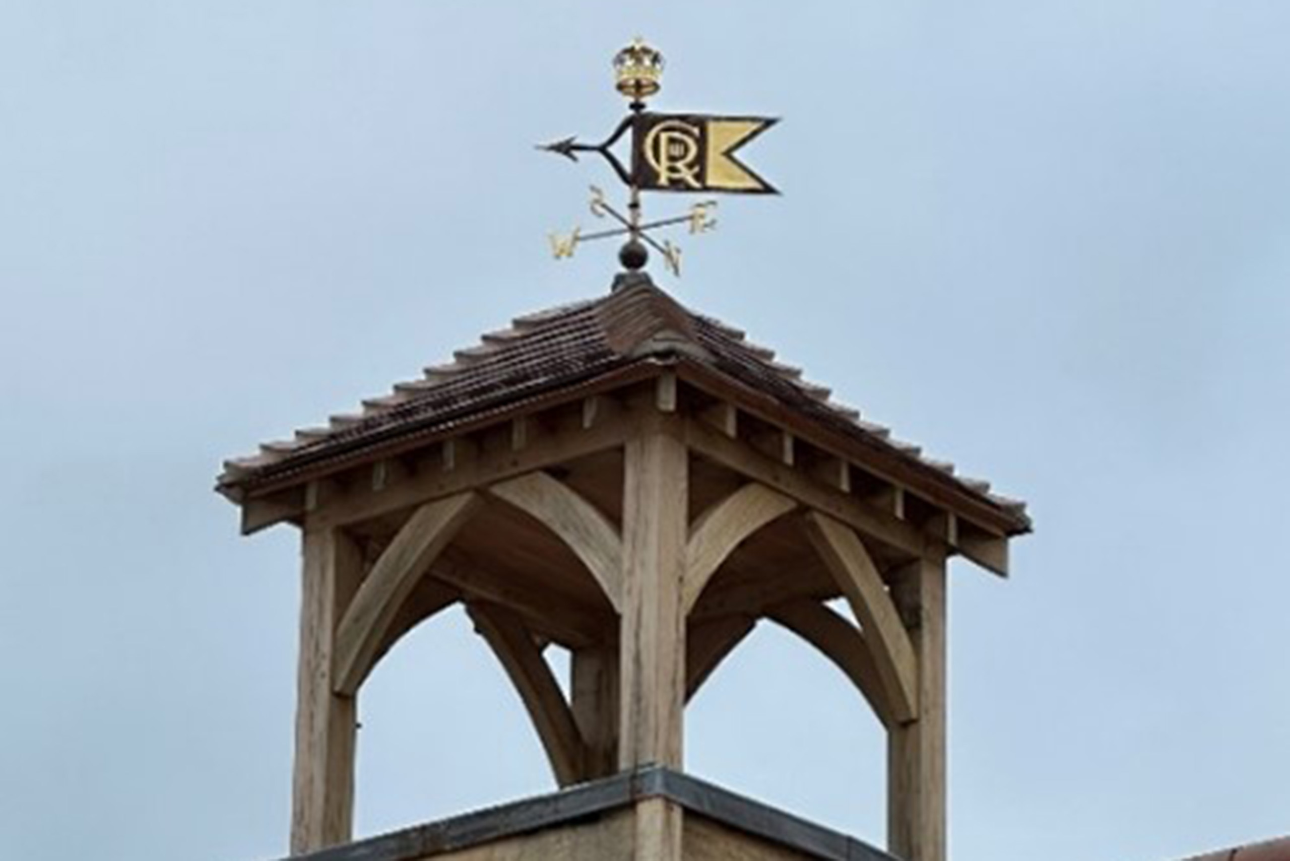 A weather vane with King Charles III's cypher.