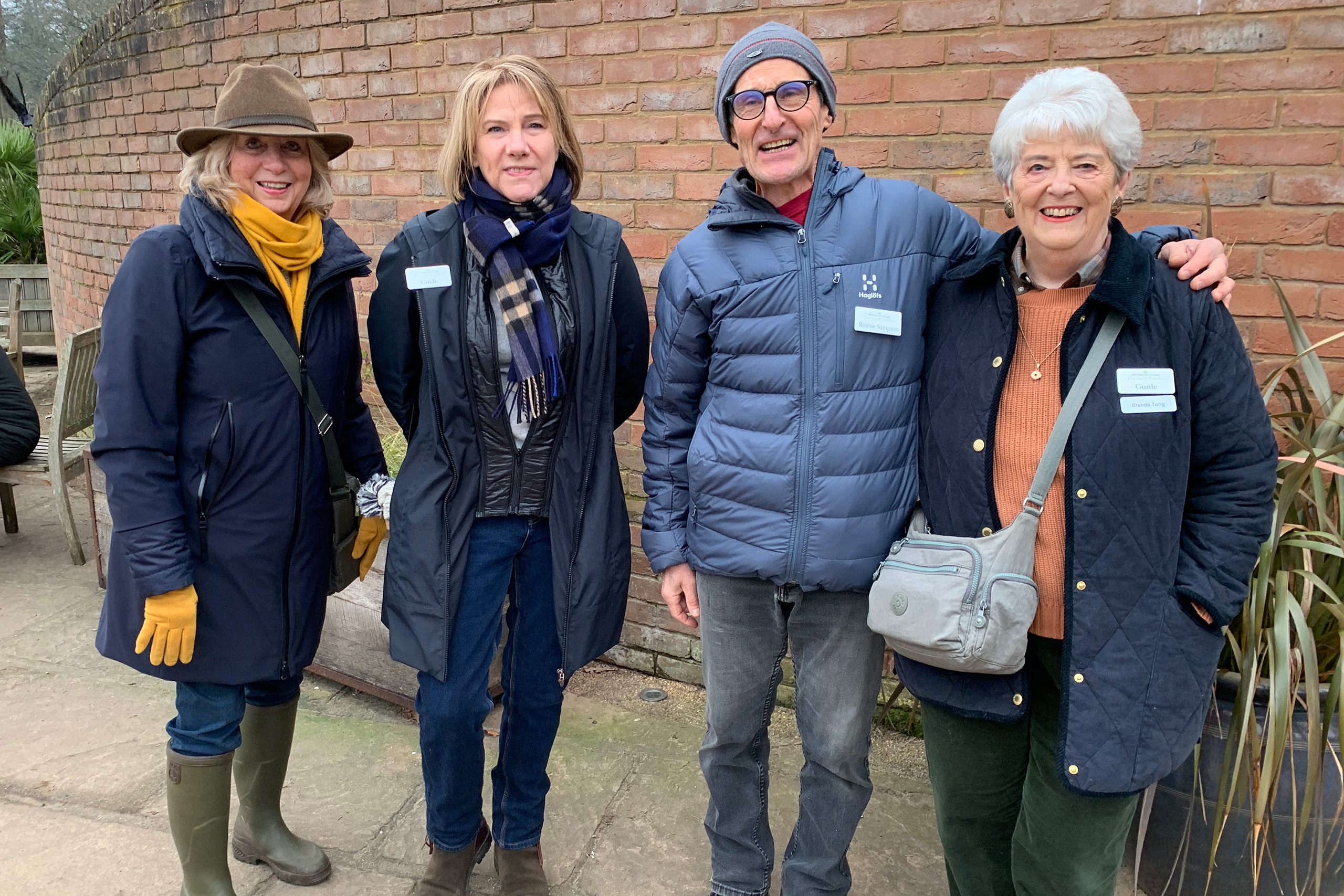 Four of the Friends Guides standing outside The Savill Garden Visitor Centre.