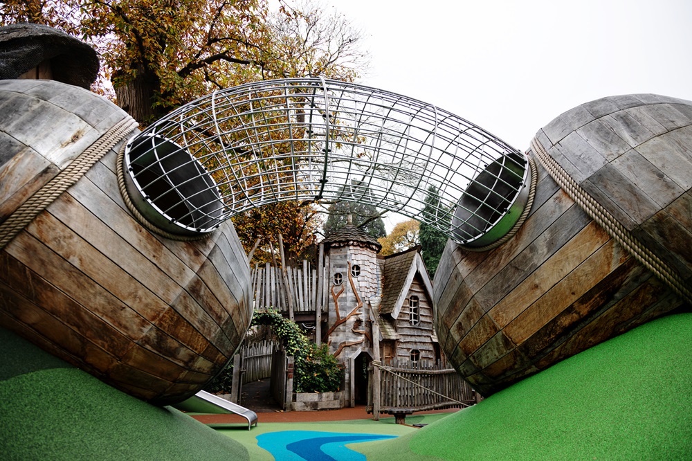Adventure Play steel tunnel between two giant acorns.