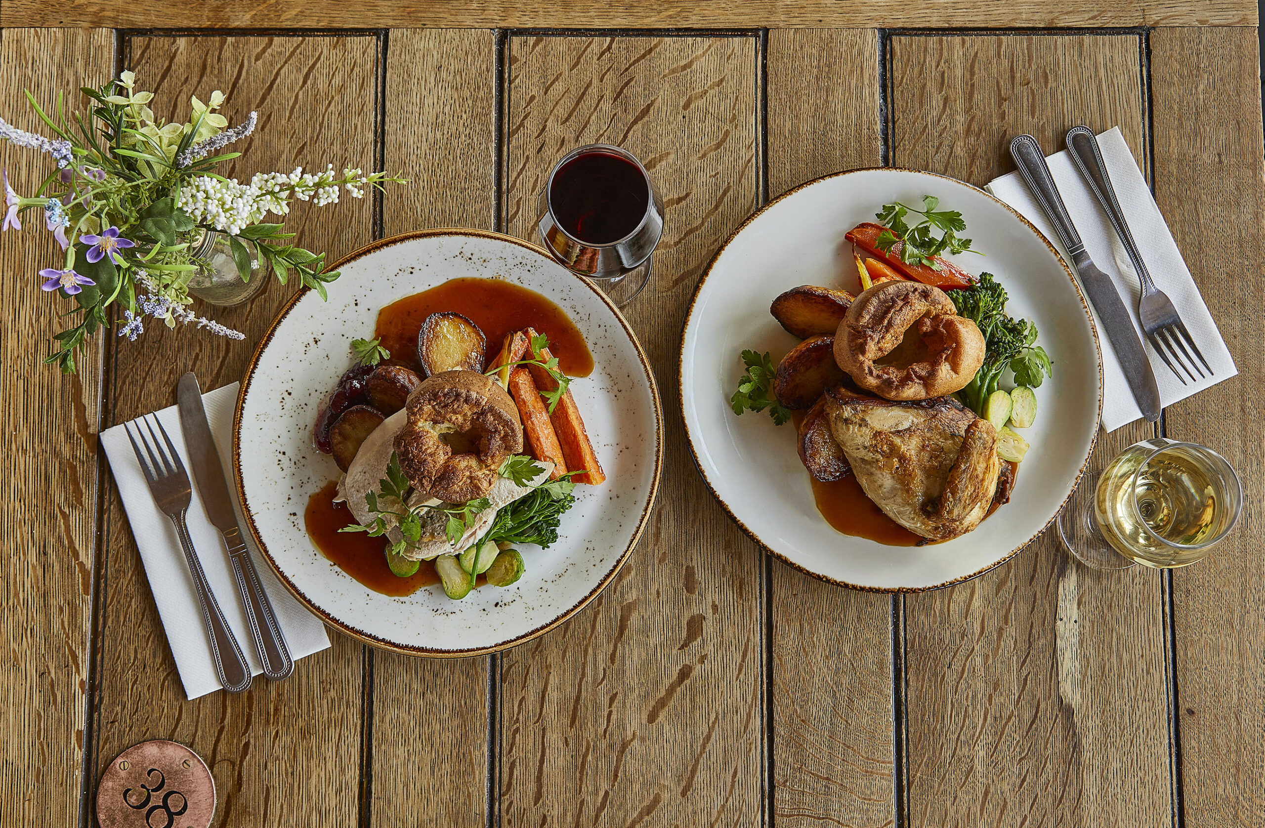 An aerial view of a wooden table laid for a Father's Day lunch