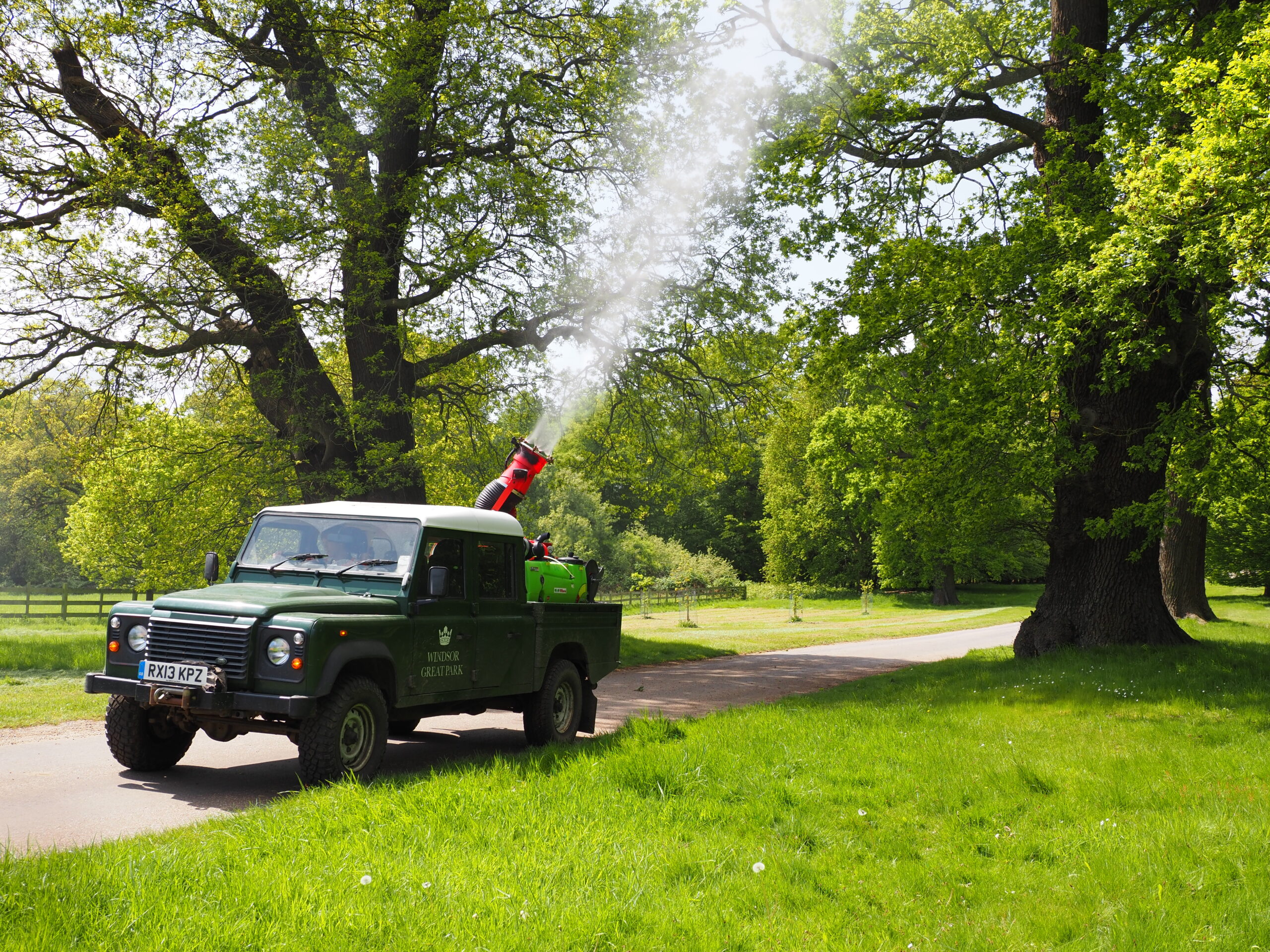 A vehicle targeting oak trees with insecticide for oak processionary moth.