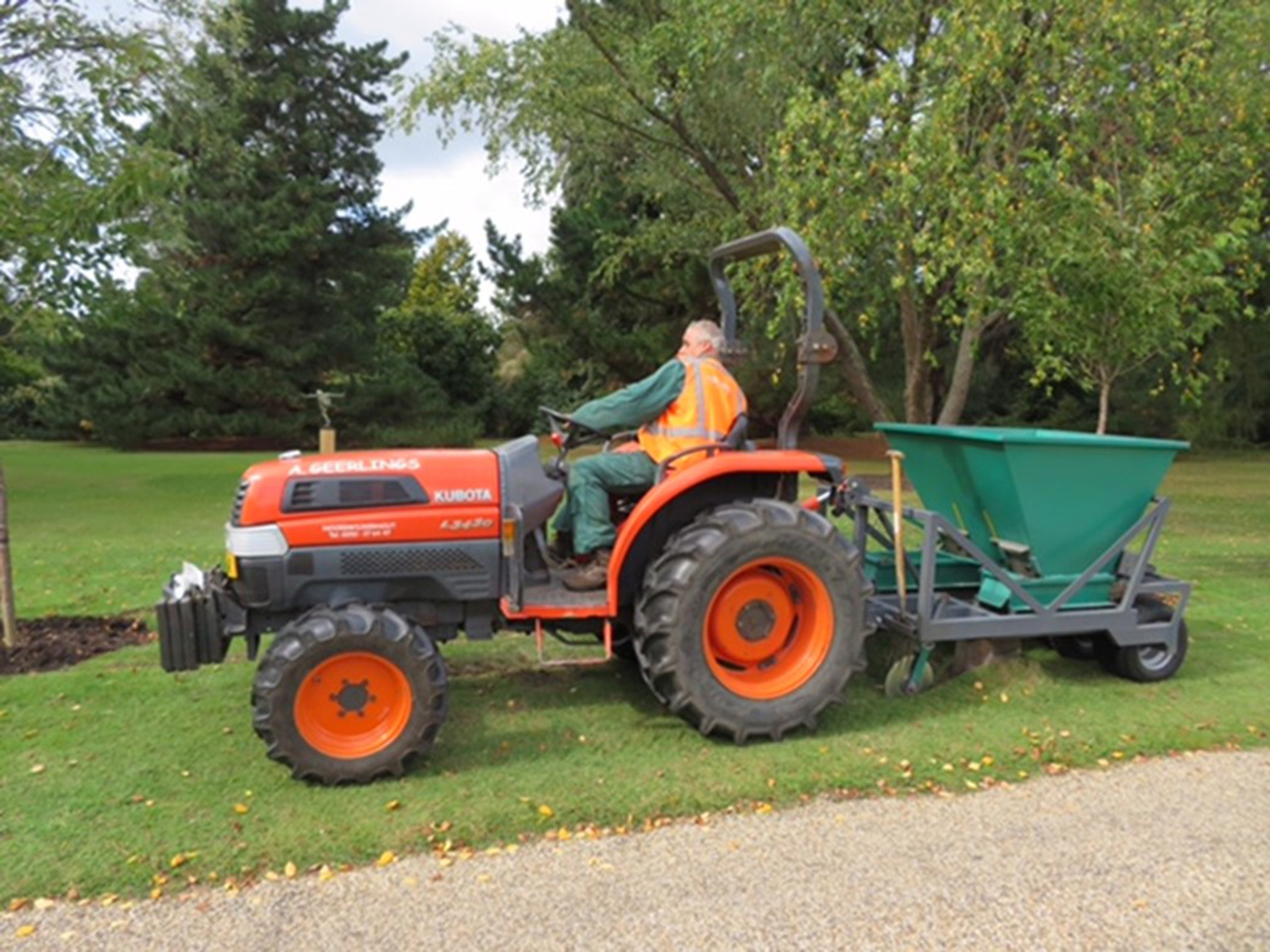 A person driving a vehicle to plant bulbs.