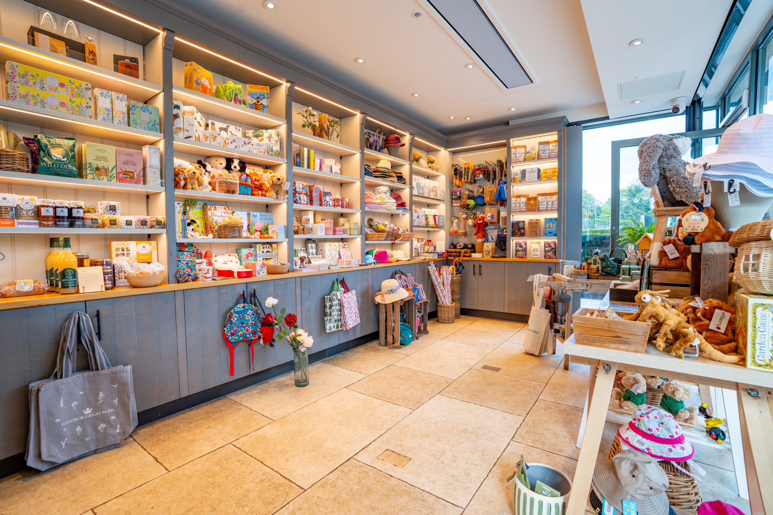 Large recessed cabinets filled with products inside a Gift Shop.