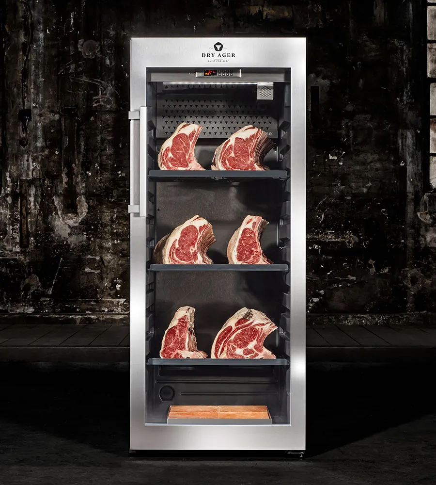 Dry-Ager fridge displaying cuts of beef.