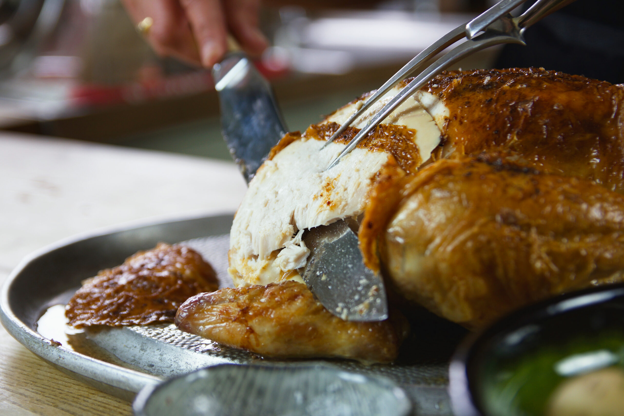 A roast chicken being carved.