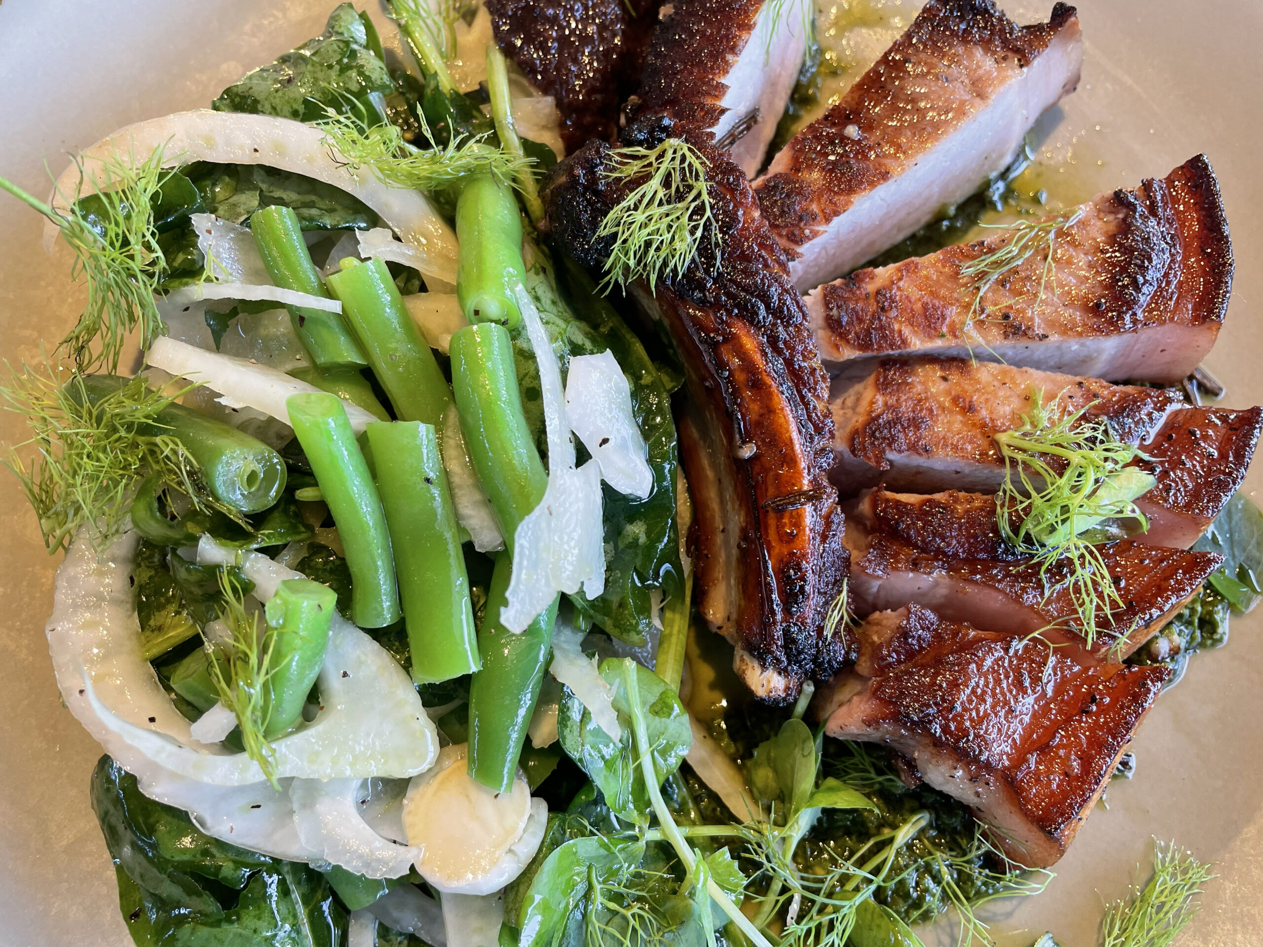Grilled Pork Chop with Fennel & Green Bean Salad, Salsa Verde and Grape Mustard.