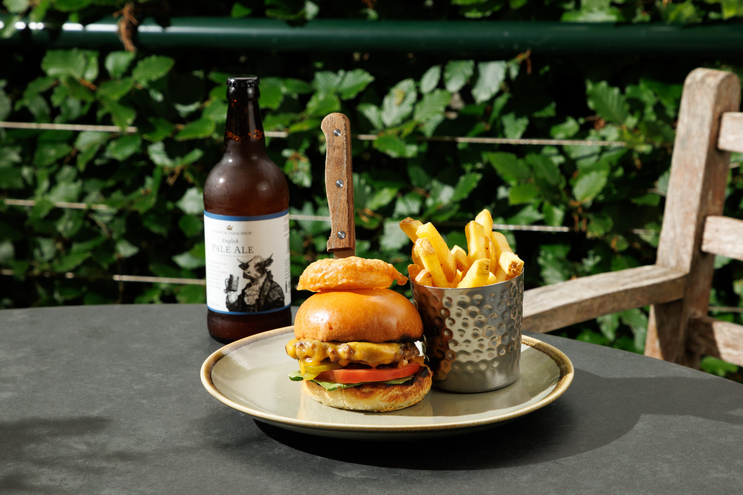 Windsor Farms Burger served with chips and a bottle of Windsor Farm Shop Pale Ale.