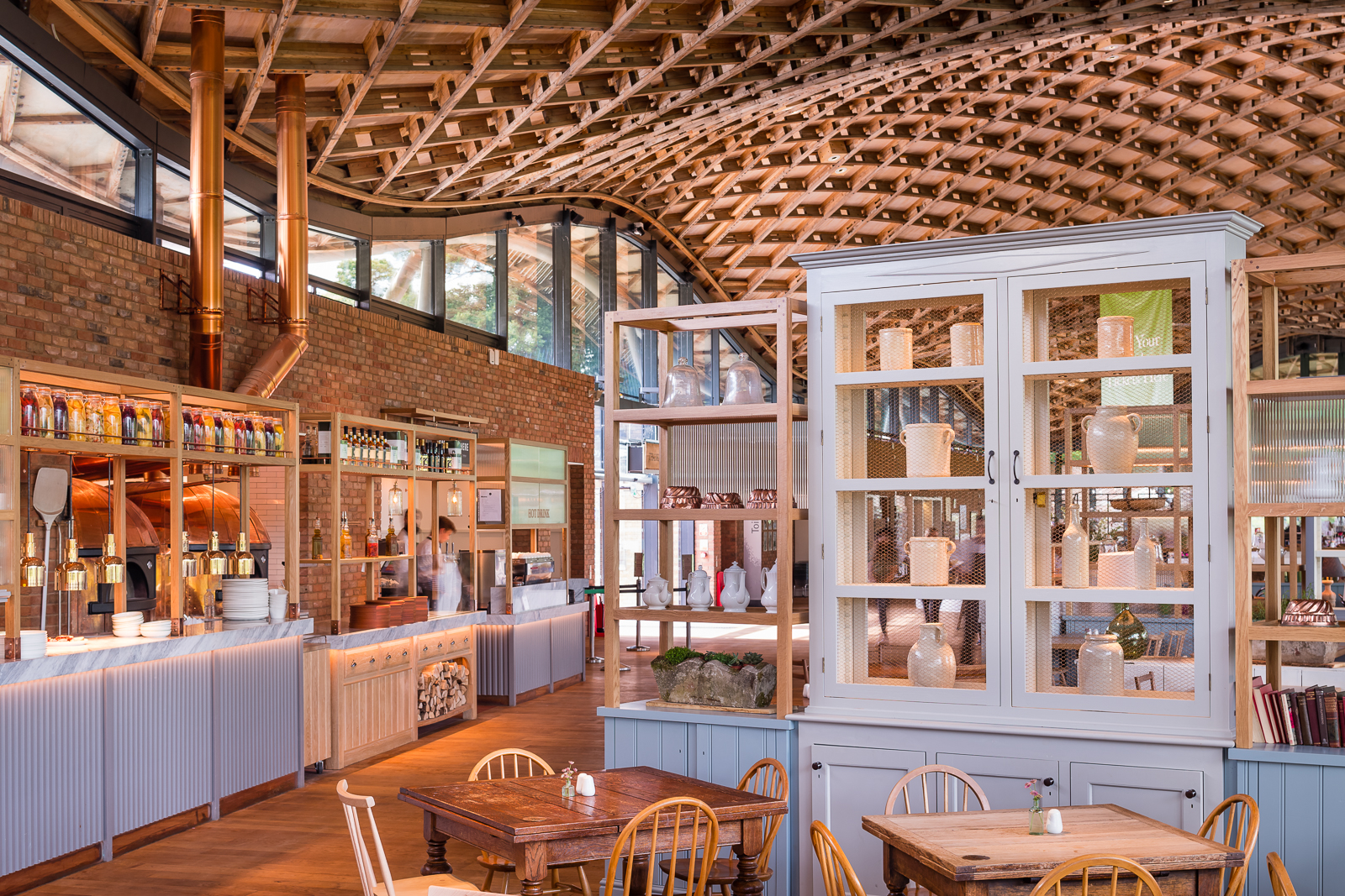 An eclectic mix of propped room dividers break up the space through the restaurant.