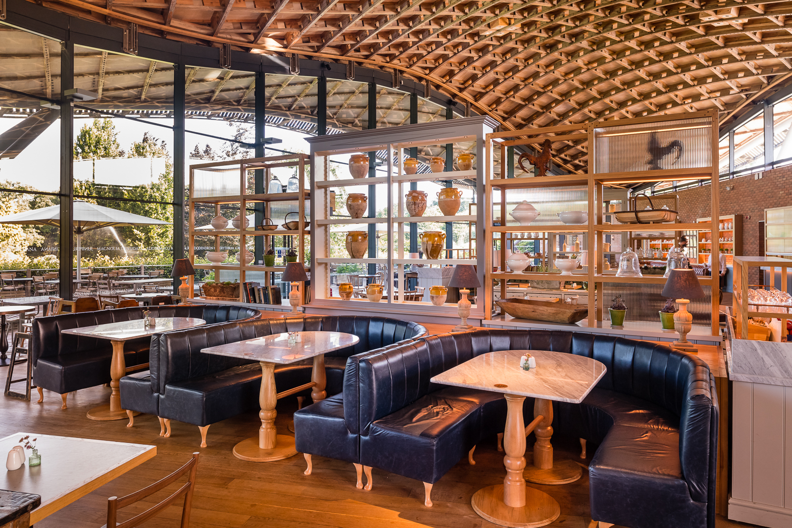 Overs-sized banquette seating surrounded by large dressers.
