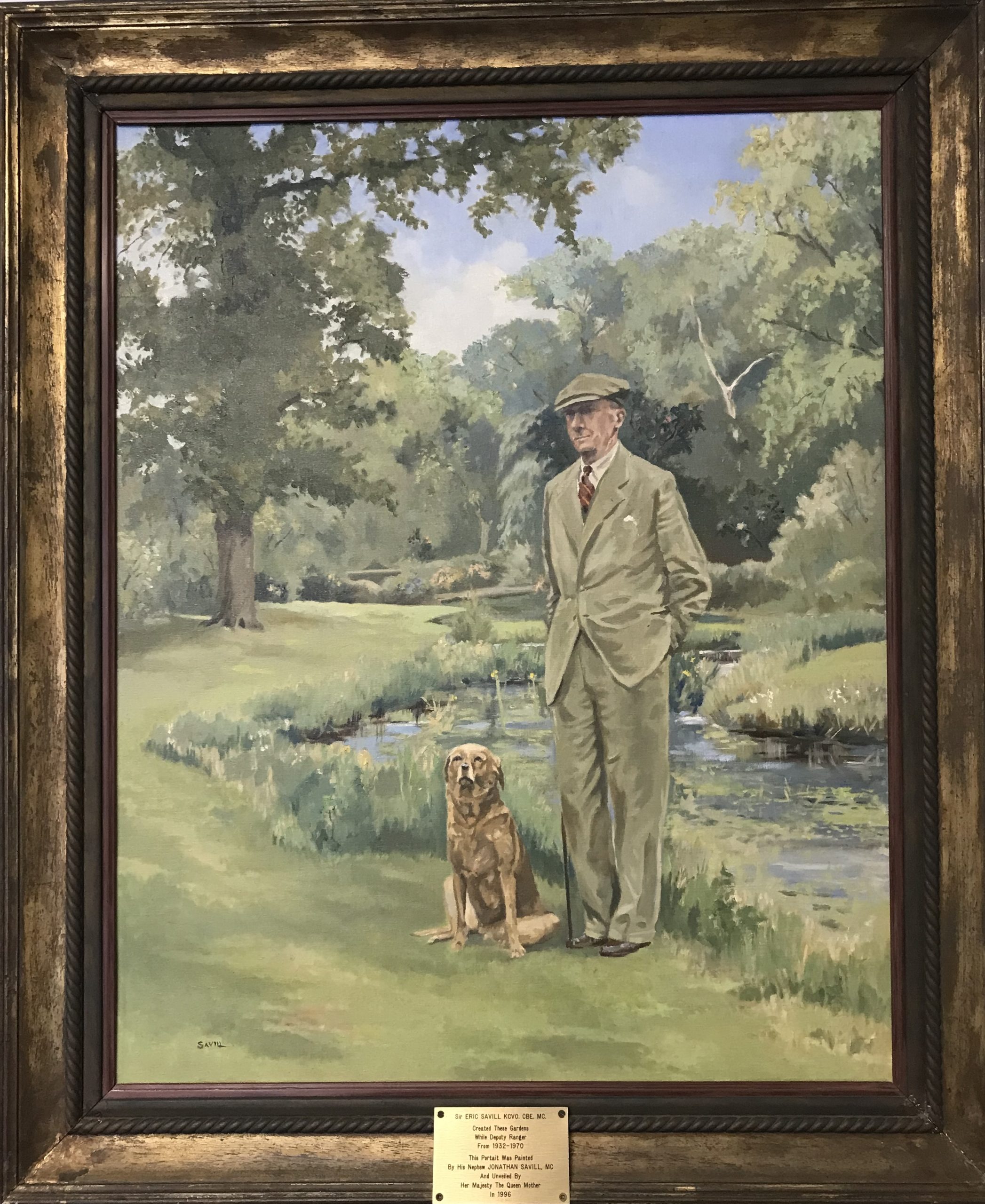 A framed artist portrait of Eric Savill and a dog in The Savill Garden.