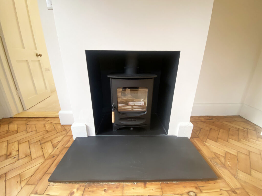 Wood burner in reception room.